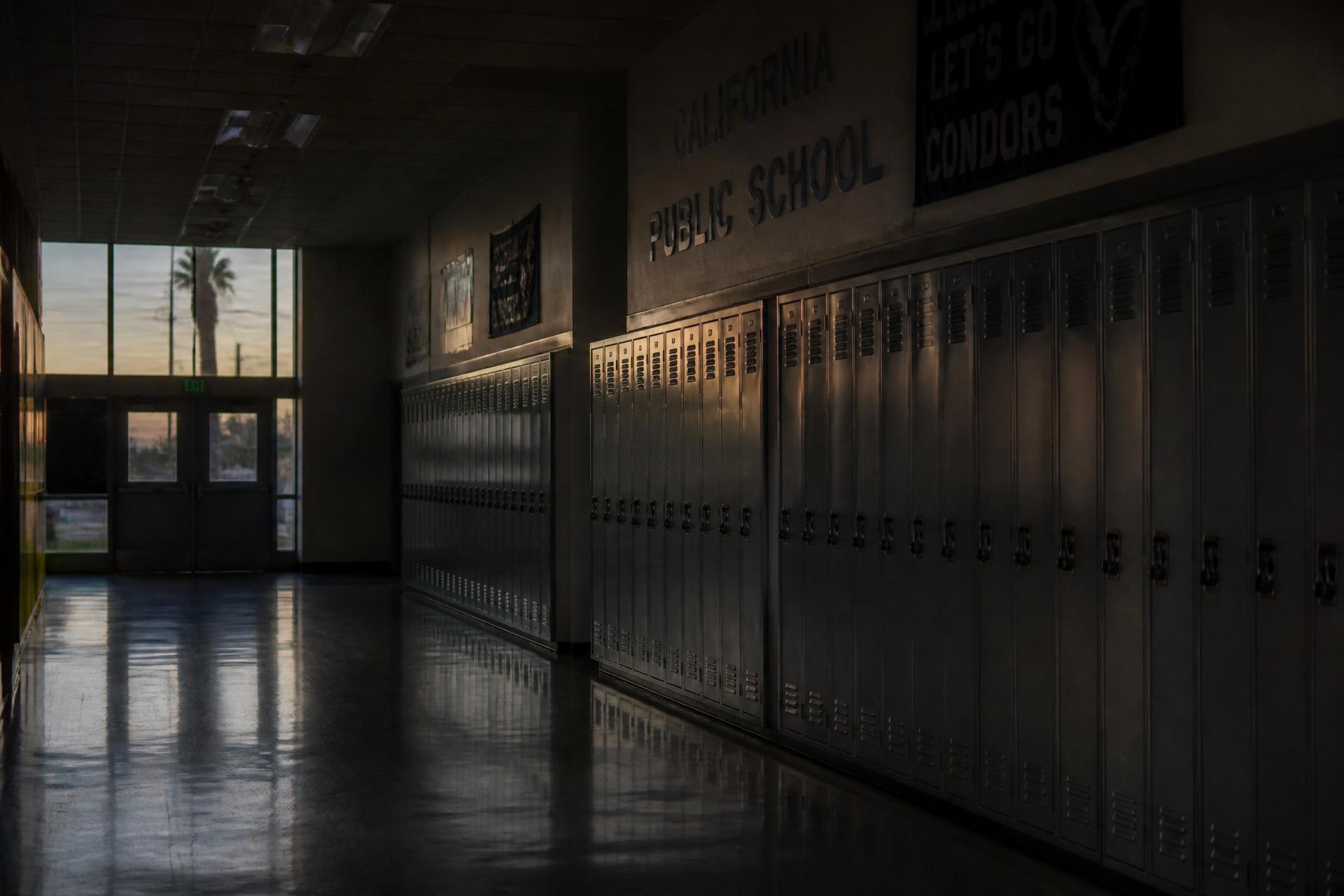 Empty California public school hallway at dusk
